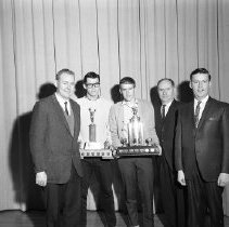 Senior Boy Soccer Co-Captains Receive Wood Trophy and WOSSA Trophy on Behalf of Team